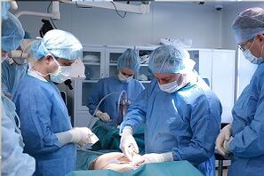 performing breast augmentation surgery